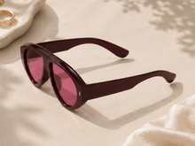 Load image into Gallery viewer, Oversized statement sunglasses with pink red tinted lenses and sculpted dark frame from Adore Her Sole.