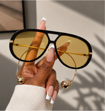 Load image into Gallery viewer, Black oversized aviator sunglasses with yellow tinted lenses from Adore Her Sole.
